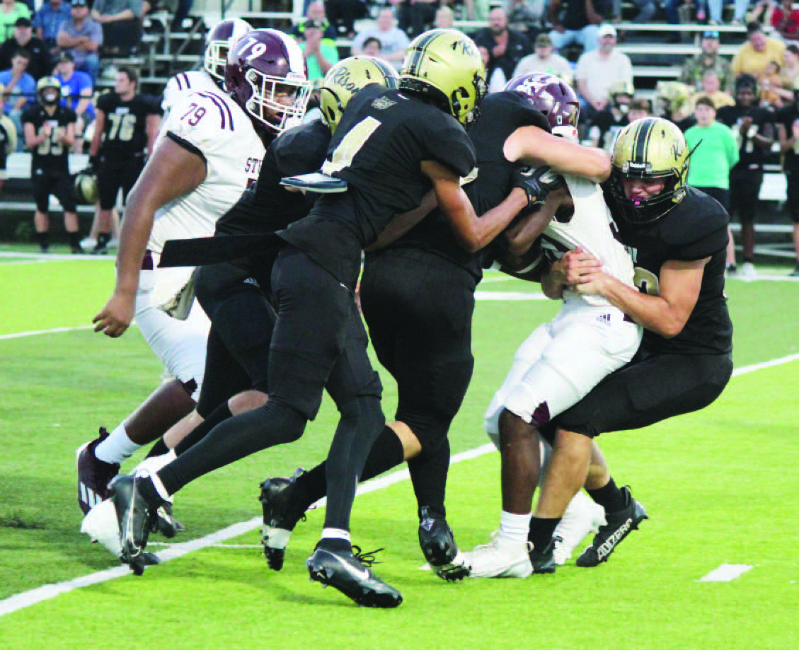 STUFFED RICEBIRD - Rison's Eli Turner (right) and Ayden Laws (s econd from right) bring down a Stuttgart Junior Varsity Ricebird for a loss in first half action Tuesday night. Stuttgart struggled to get anything going against the Wildcat defense in the first half as Rison raced out to a 36-0 lead by halftime. Also in on the play the play for Rison are Ethan Saeler (left) and Braylin Bennett (second from left).