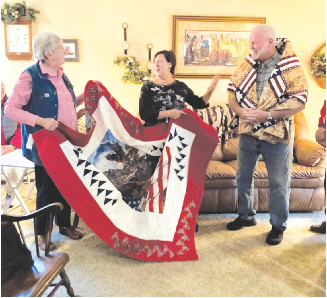QUILT OF VALOR PRESENTED - Holly Gerard Taylor and her husband Kevin Taylor each received the Quilt of Valor for their years of service to the United States Army.