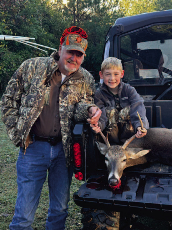 FIVE POINT - Locklan Smith, age 7, killed this five-point buck hunting with his Papa Jimmie Lockhart in Toledo .