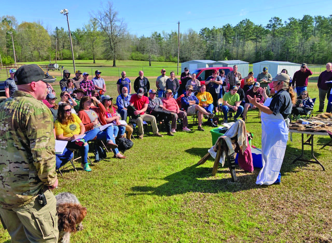 TANNING HIDES - Shona Jordan, a taxidermist and hometeader from Pike County, demonstrates the process of converting a hide into a pelt at the 2023 Arkansas Homesteading Conference. Jordan is scheduled be back as this year for one-on-one conversations.