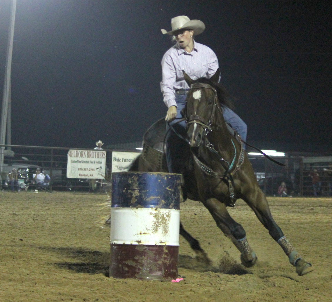 CLEVELAND COUNTY FAIR RODEO ACTION - Leanna Britton, an agri instructor at Rison High School, makes a turn during barrel racing action Saturday night at the Cleveland County Fair Rodeo. Fair Board President Roy Phillips said attendance was good for both Friday and Saturday night events, and the fair board wants to make the rodeo a central part of the fair in the future.