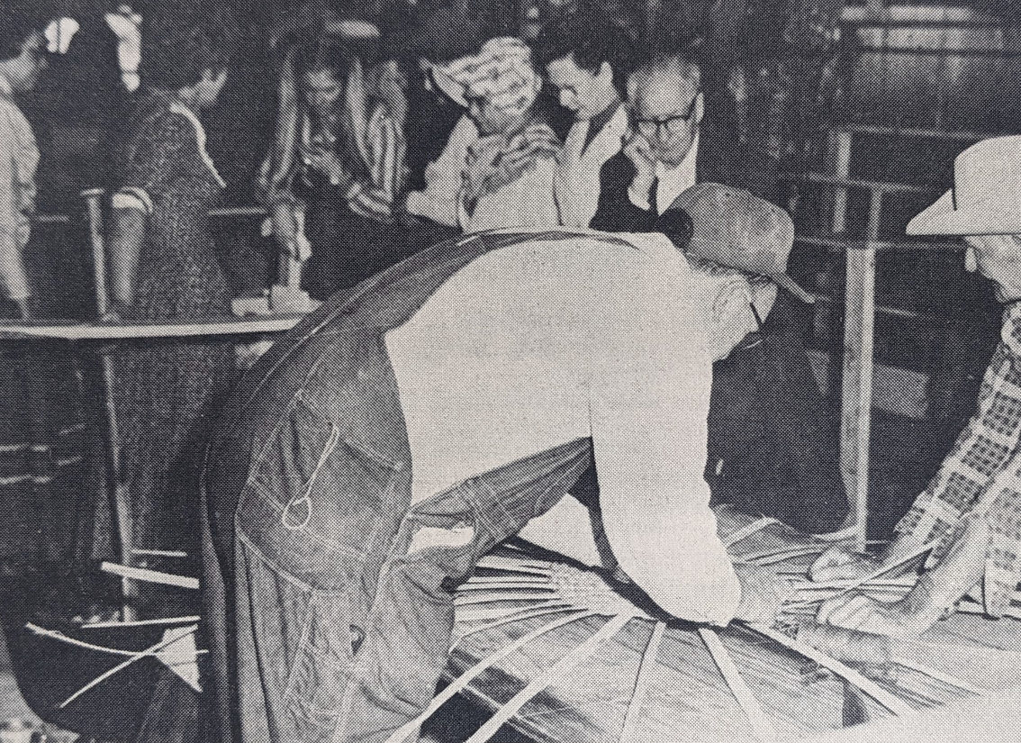 REVIVING THE PIONEER CRAFTS FESTIVAL - The Pioneer Village at Rison is seeking the revive its historic heritage crafts festival for March 2023. In this file photo from the Herald in 1975, Thomas Peters and Matt McGriff begin weaving a basket as the crowd browses down the isle viewing the exhibits and demonstrations. At this event in 1975, guests came from as far as St. Charles, Mo. to attend the festival.