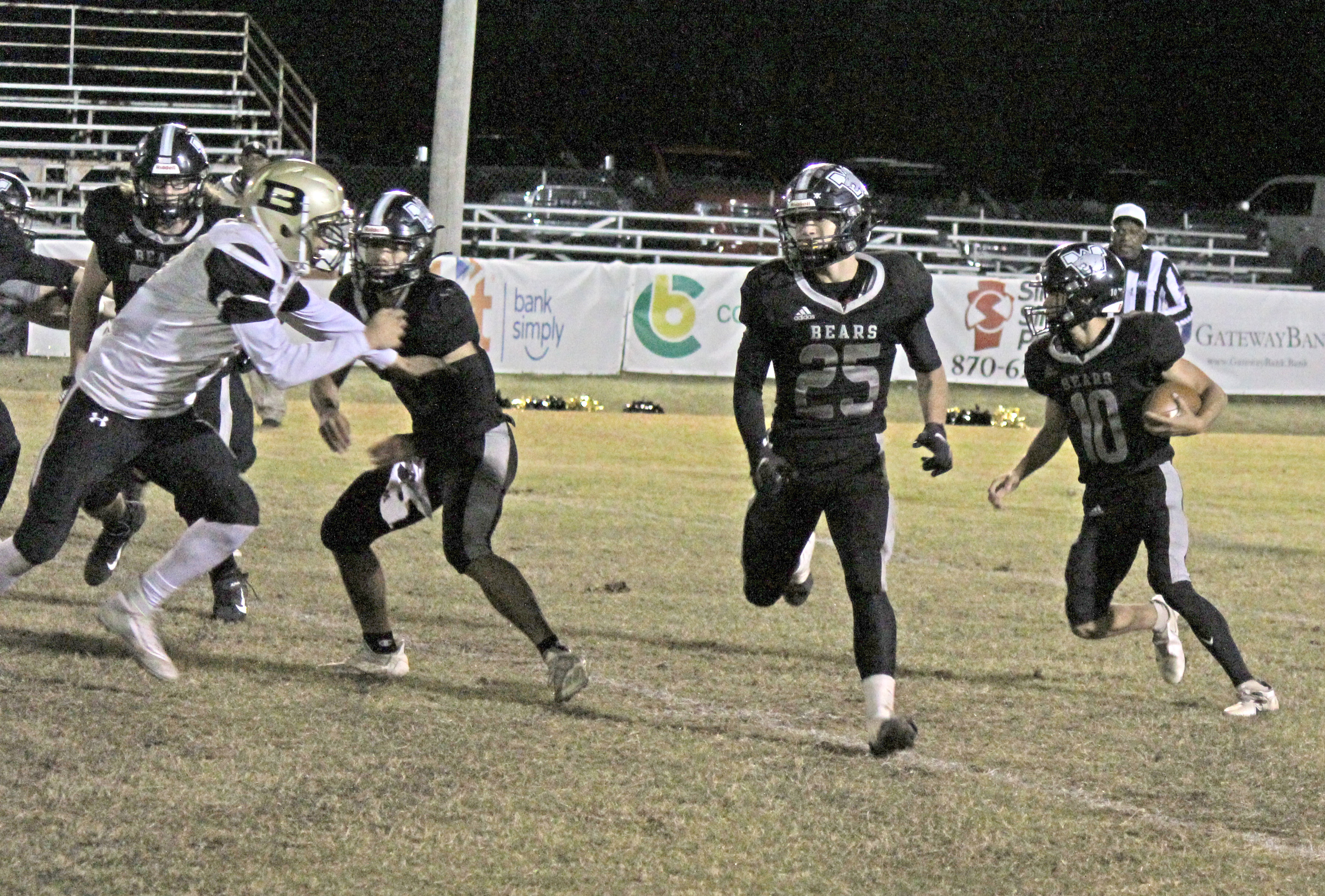 TRIPLE THREAT - Woodlawn senior running backs Caleb Martin (left) and Fisher Hale (center) set up a play for senior quarterback Jaxson Martin (right) during last Friday night’s 60-16 win over Brinkley. All three finished the game with more than 100 yards of total offense, helping the Bears amass 500 yards in total offense for the game.