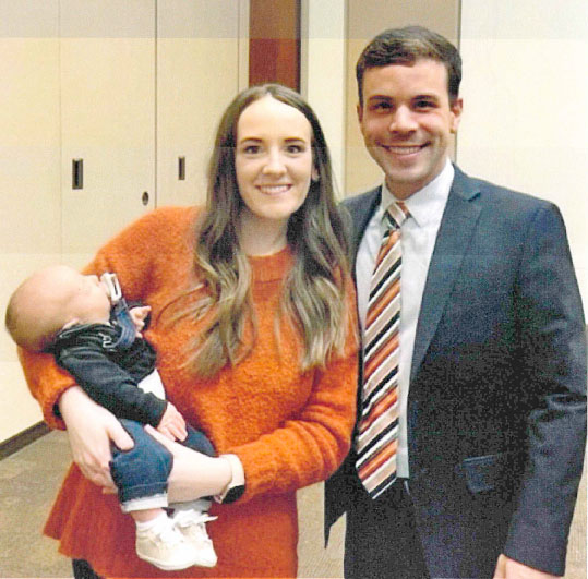 Rison Coach Caleb Carmikle (right) with wife, Madison Carmikle, and their new son, Cooper