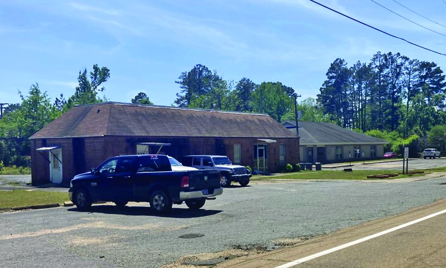 LEAKING ROOFS - The Cleveland County Cooperative Extension Office (left) and the Cleveland County Health Unit (right) are two of three countyowned buildings that are currently having problems with leaking roofs. The Extension Office and Health Unit are located next to one another on Magnolia Street in Rison. The county jail, located in the county courthouse complex, is having the same issue as well.