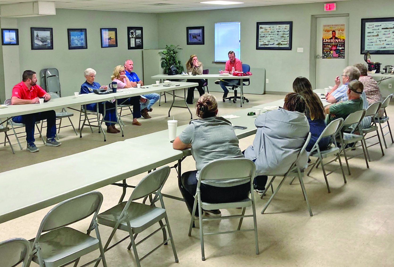 FINALIZING PLANS - Celeste Beatty, Rison Shine president, and Douglas Boultinghouse, Rison in the Fall organizer, (left to right at table in center) go over festival plans with volunteers Tuesday night at the Hall-Morgan Veterans Building in Rison. Based on attendance at other festivals, Boultinghouse said headliner David Nail could attract anywhere from 1,000 to 2,000 for his show on Saturday night, Oct. 7.