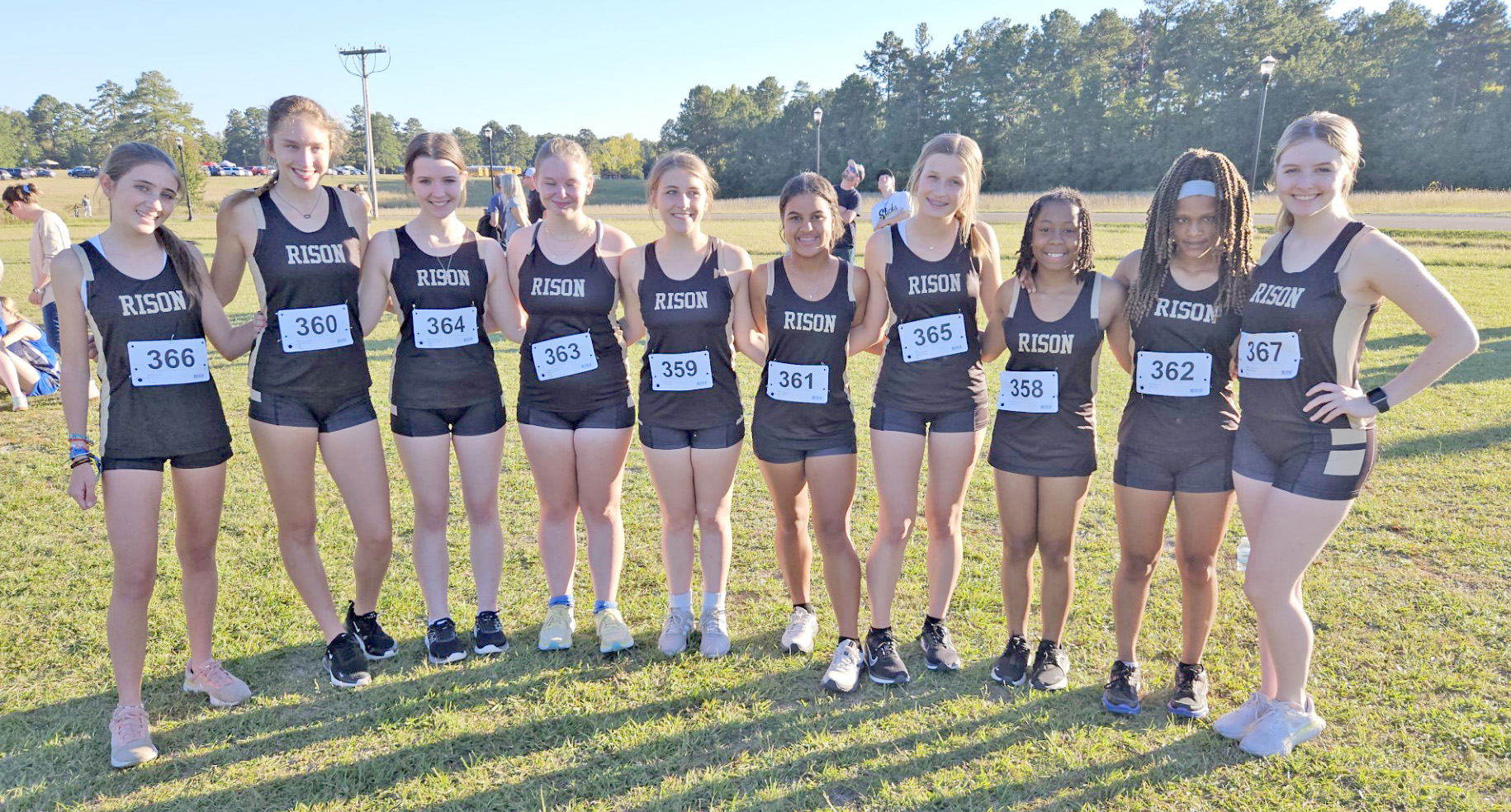 SOUTH REGION CHAMPIONS - Members of the Rison Lady Wildcat cross country team pose for a team photo after winning the Class 1A/2A South Region Cross Country Championship on Oct. 17 at El Dorado. Pictured are (left to right) Lara Sotres, Olivia McCarty, Ragan Shrum, Harley Rowland, Victoria James, Rhagen Price, Haven Simpson, Kayla Jackson, Ariel Rainey and Anna Vallance.