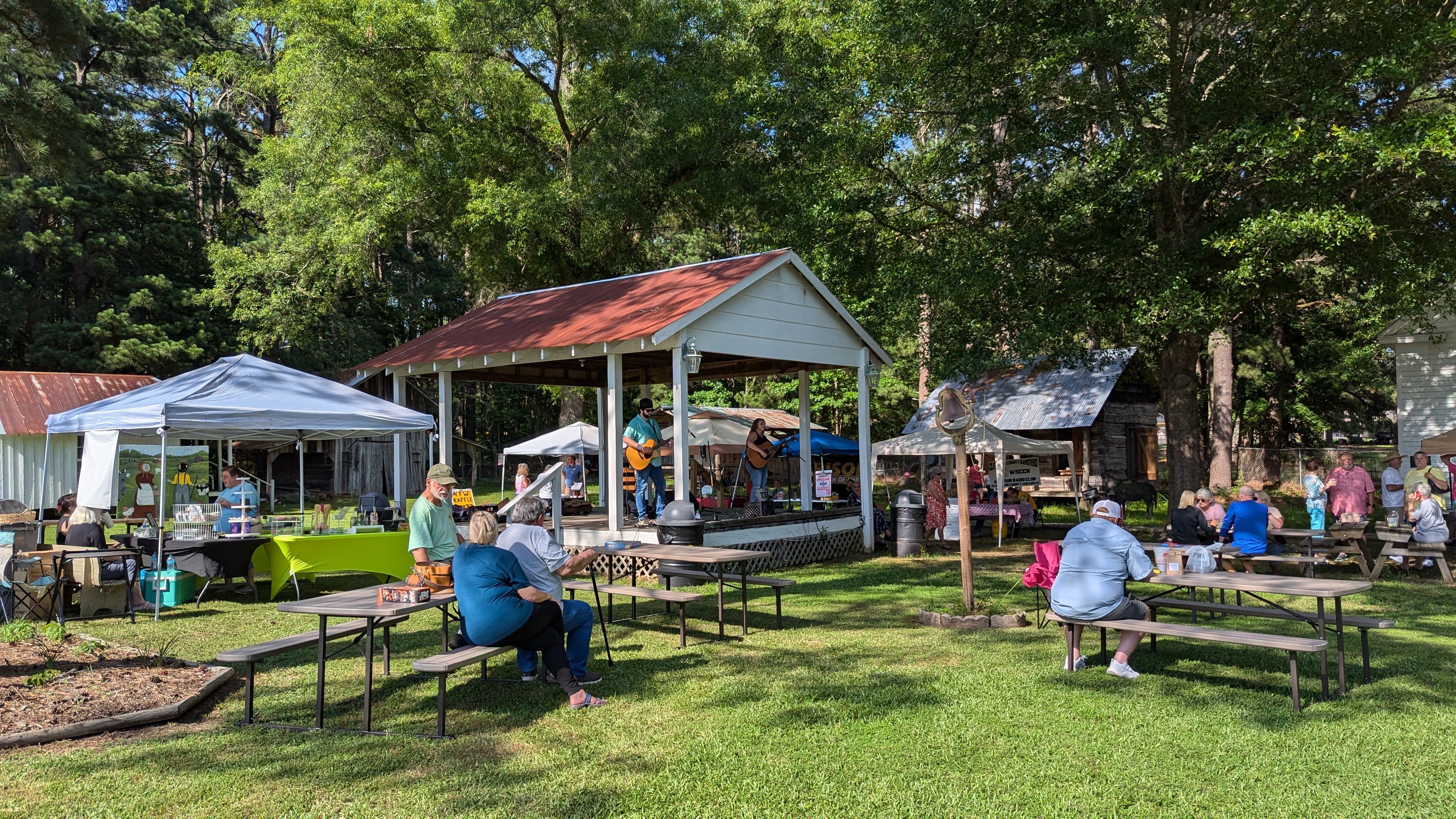 Attendees enjoy the Rison Farmers Market vendors and live entertainment from duo Laura Caroline and Brian Mullen.