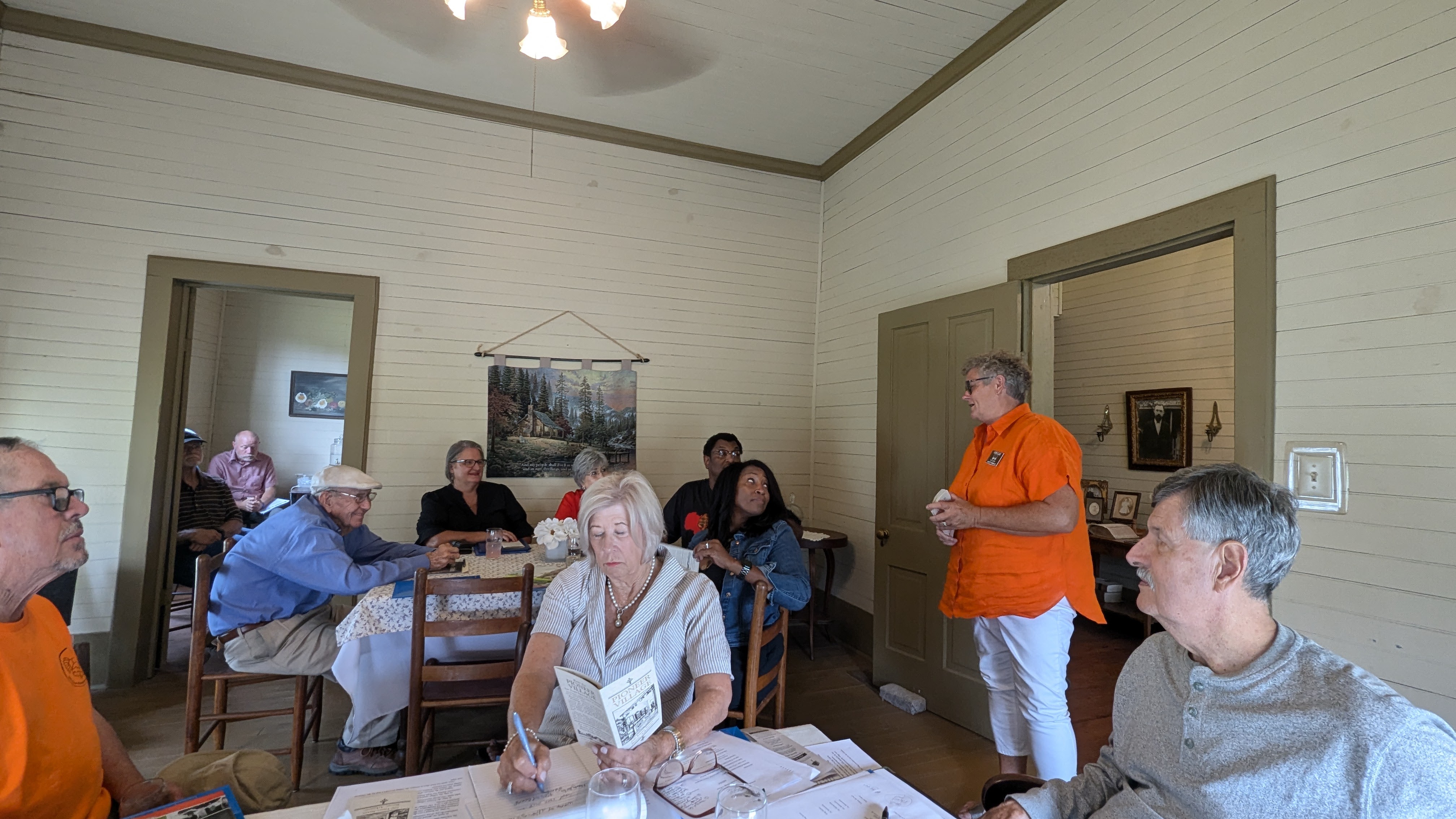 Pictured above is Pioneer Village President Marty Bowlin (standing) sharing the history of the historic property. 
