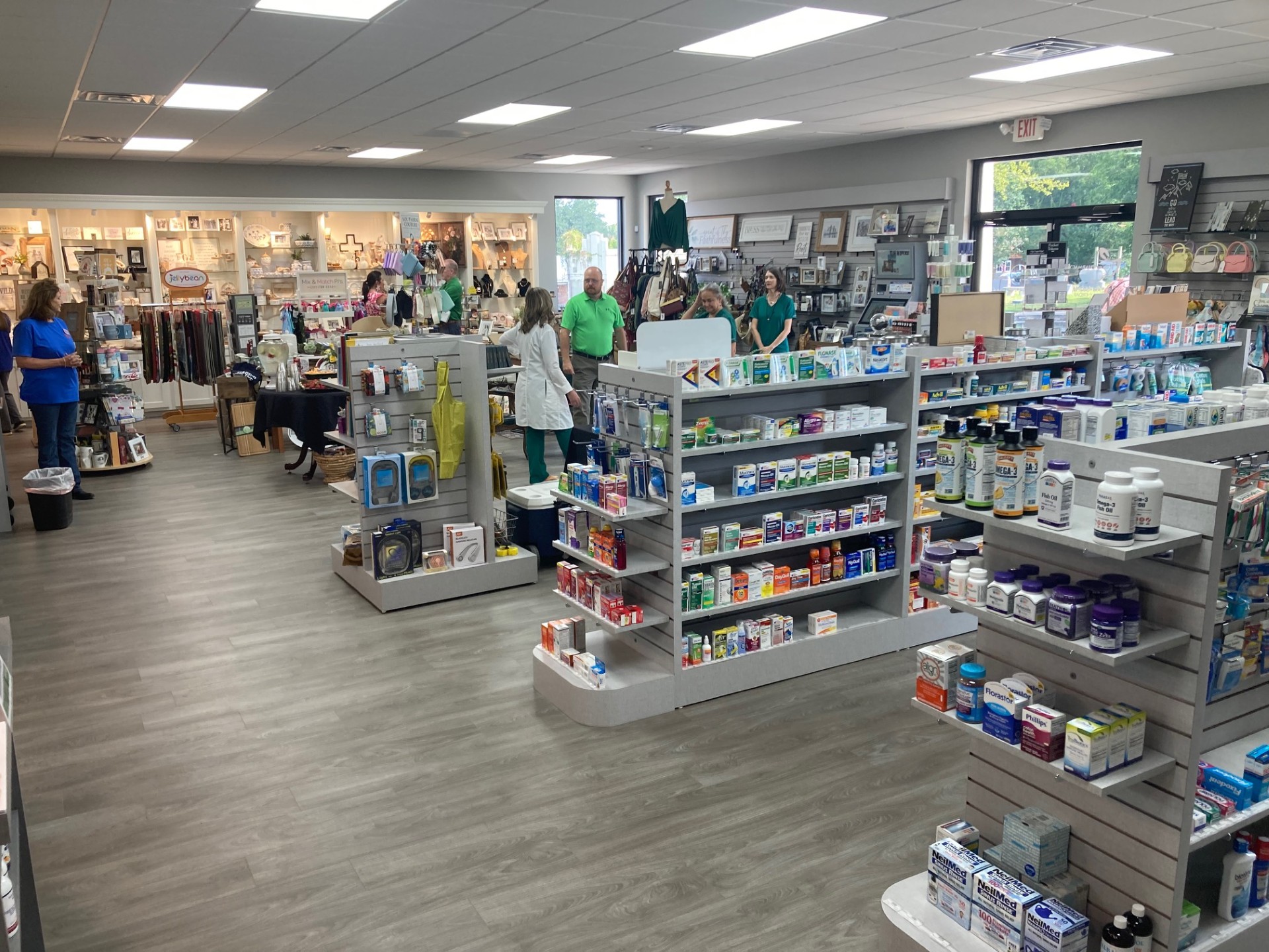 INSIDE NEW RISON PHARMACY - Visitors begin filing inside the new Rison Pharmacy and Wellness building for its open house last Friday morning. While the business moved into its new facility earlier this summer, Rison Pharmacy owner Lynn Wilson waited until last week to have an open house to officially kick off the new location. Wilson said the new building provides about twice as much space as the old location, and it also includes a new gym and fitness center called Rison Grind at the back of the building.