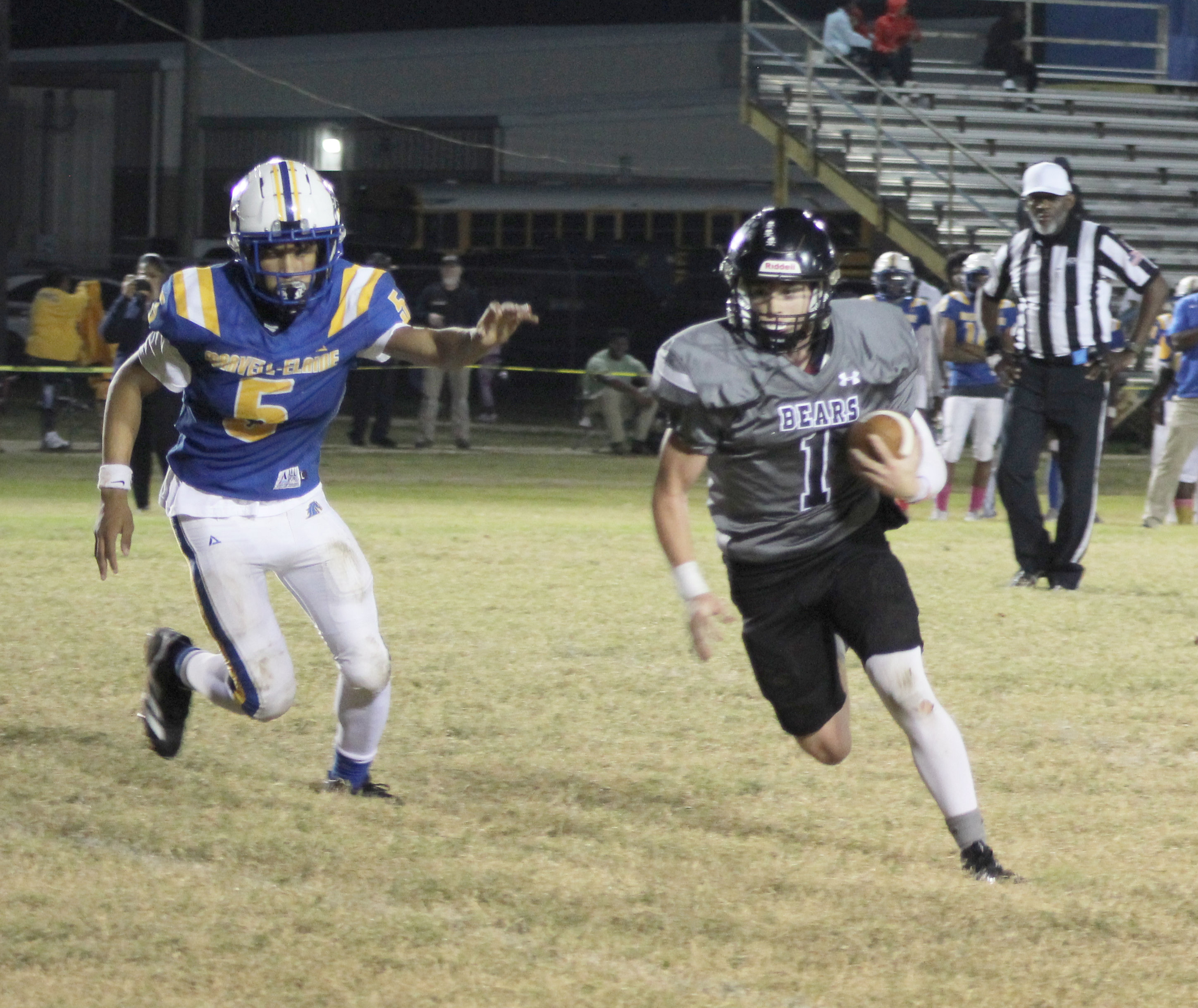PRODUCTIVE GAME FOR MOORE - Woodlawn quarterback Aden Moore (right) breaks outside of Marvell’s Dimitrius Thompson for a two-point conversion in the Bears’ 64-26 win over Marvell last Friday night. Moore had a productive night on the ground and through the air running for two touchdowns and three two-point conversions while throwing for one TD and one two-point conversion. His teammate, Ethan Adair, also accounted for three touchdowns.