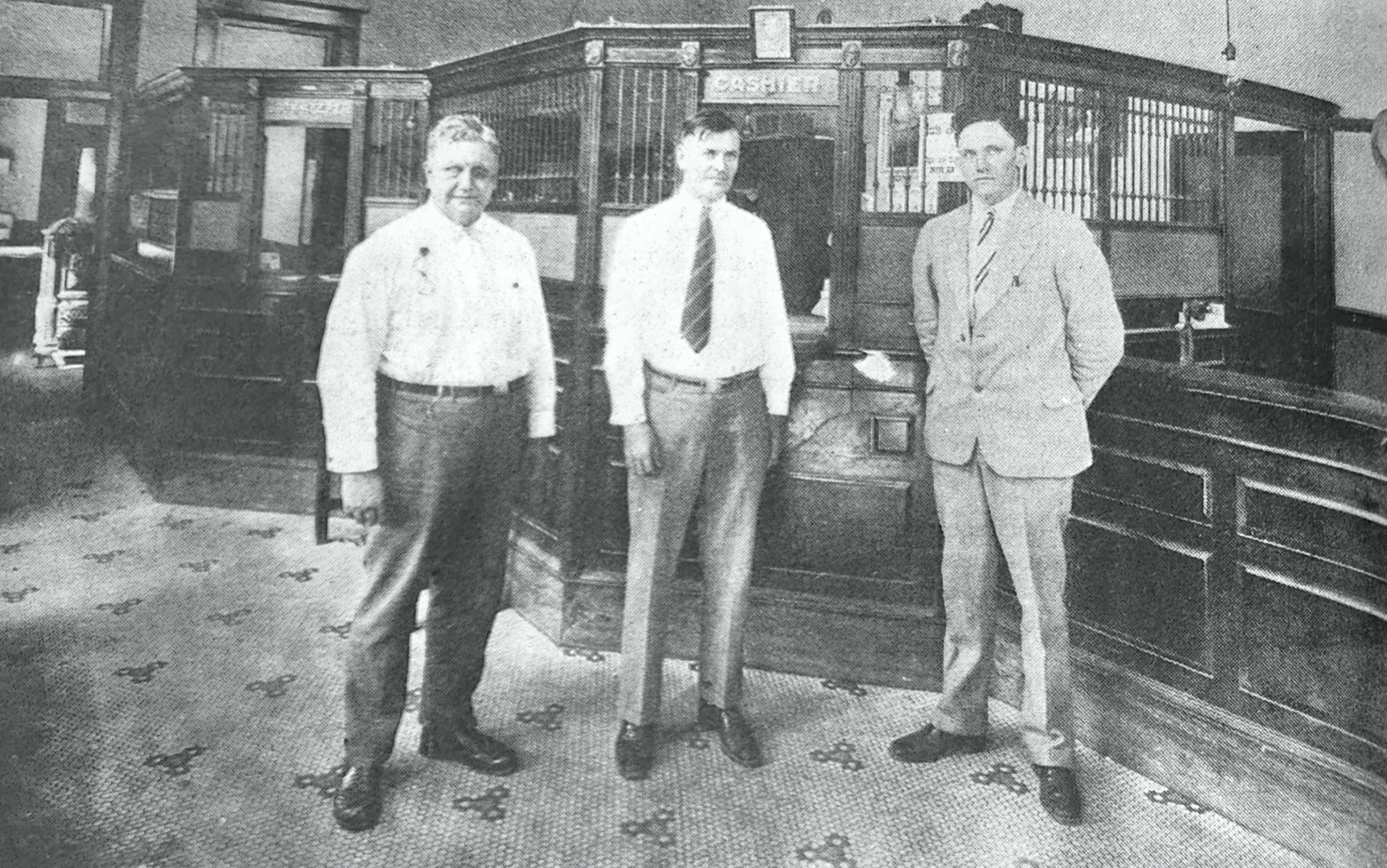 GLIMPSES  FROM  THE  PAST - This glimpse from about 1928, shows the inside of the Bank of Rison when it was located on the northwest corner of Second and Main streets. Identified in the photo are, left to right, J.W. Elrod, H.G. Attwood and Searcy Elrod. Later the bank was located at the southeast corner of Second and Main, and today, Gateway Bank (formerly The Bank of Rison) is located at the northeast corner of Second and Main. For questions or comments, contact Stan Sadler at sadler.stan@yahoo.com