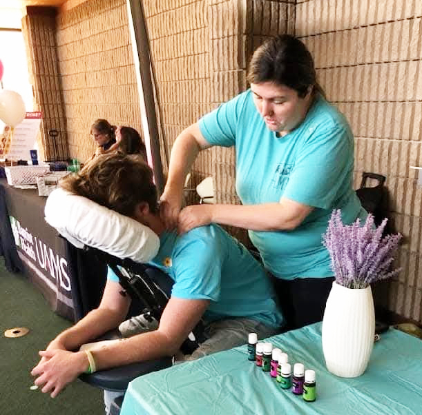 CHAIR MASSAGE - Master Massage Therapist Kristy Strother, owner of Rison Serenity Wellness Spa, gives a chair massage at an event at the University of Arkansas at Monticello. Strother discusses her massage techniques, and potential bills impacting the massage therapy industry in Arkansas, on this week's episode of the Free Range Conversations podcast. (Photo compliments of Kristy Strother)