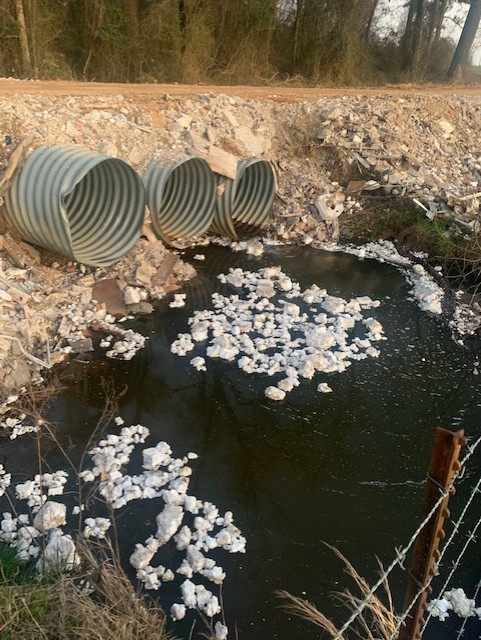 STYROFOAM PROMPTS COMPLAINTT - This photo submitted by Robin Peddy of the Herbine community shows the styrofoam from the rip-rap placed along Lonesome Dove Road that ended up in the creek. In addition, she said it has parts of bathroom fixtures and large pieces of metal in it as well. County Judge Jimmy Cummings said the county road departme nt will no longer use the rip-rap from the old nursing home demolition.