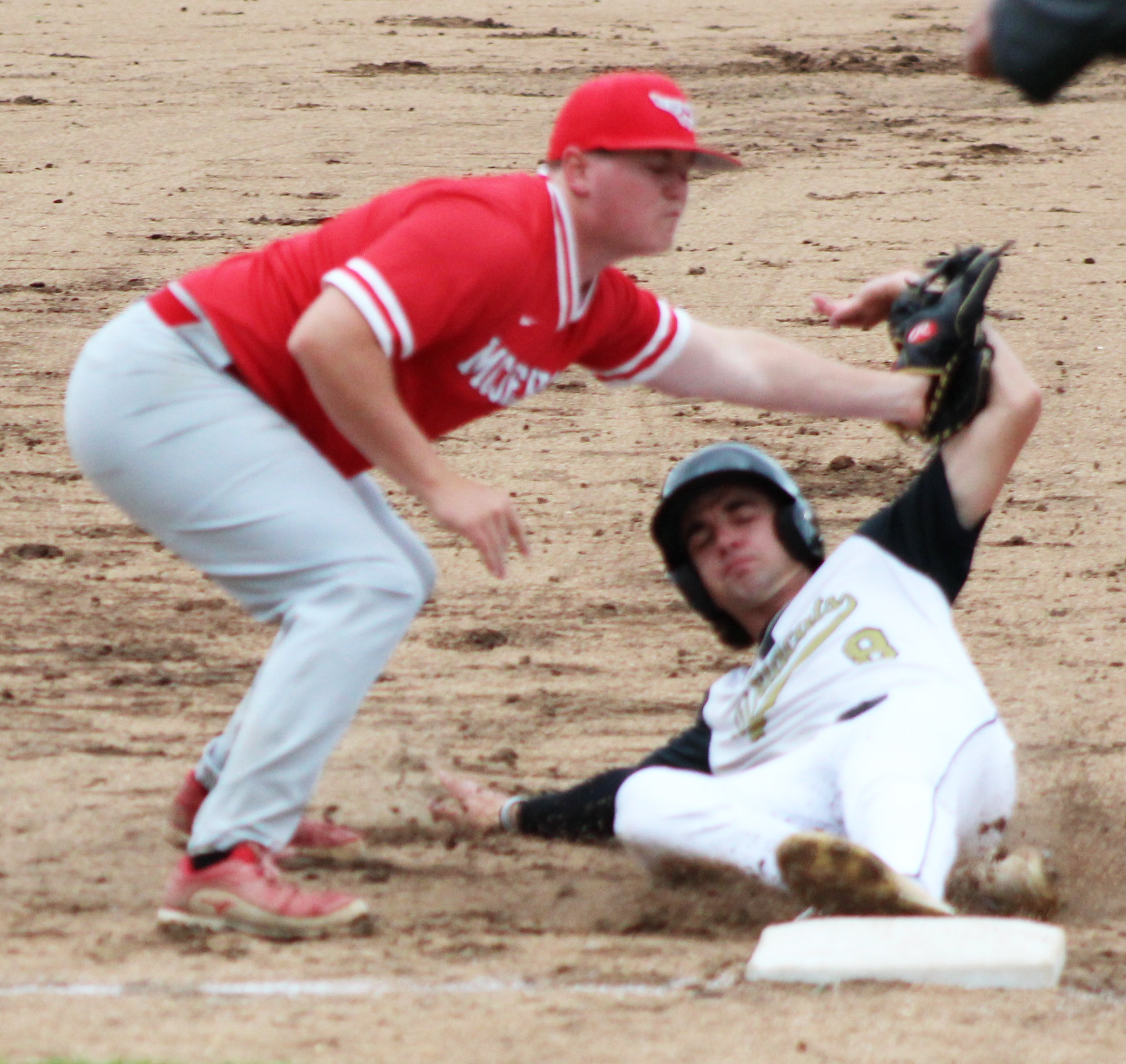 WILDCATS WIN 8-3A TITLE - Rison’s Lawson Kidd (right) slides safely into third before taking advantage of a throwing error to race home for the first run of the game in the Wildcat’s 4-0 victory over the McGehee Owls Friday at Wildcat Field.  The victory gave the Wildcats their first conference title in 21 years as they head to the Region 4 Tournament this week at Ashdown as the 8-3A’s no. 1 seed.