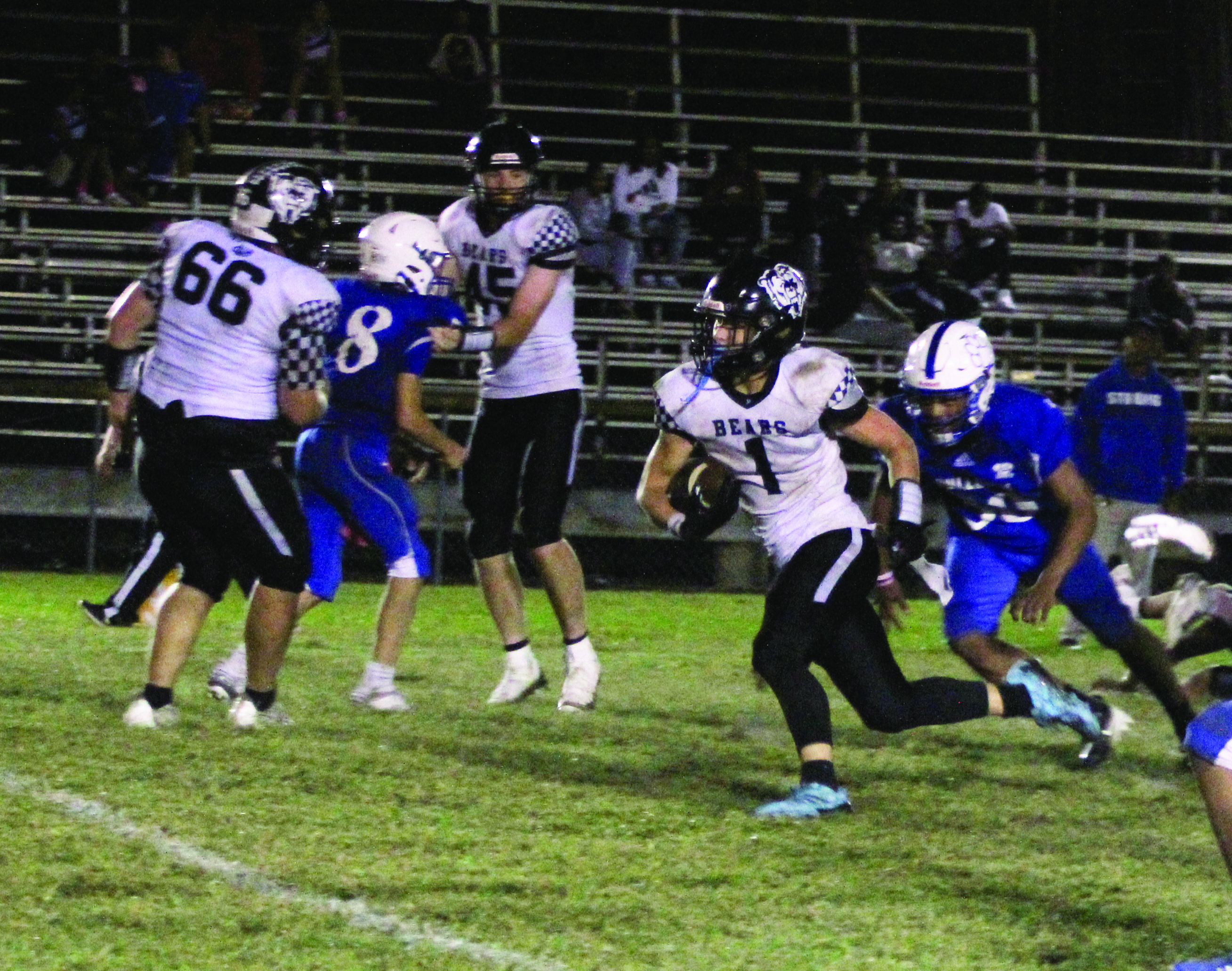 BREAKING FREE - Woodlawn sophomore running back Griffin Manes (1) breaks free for a 32-yard touchdown run late in the third quarter as the Bears pulled away in the second half for a 58-34 win over the Strong Bulldogs Friday night. Manes and quarterback Ethan Saeler combined for 366 yards rushing with Manes going for 184 and Saeler for 182. Also pictured for Woodlawn are Dakota Campbell (66) and Beau Watson (45).