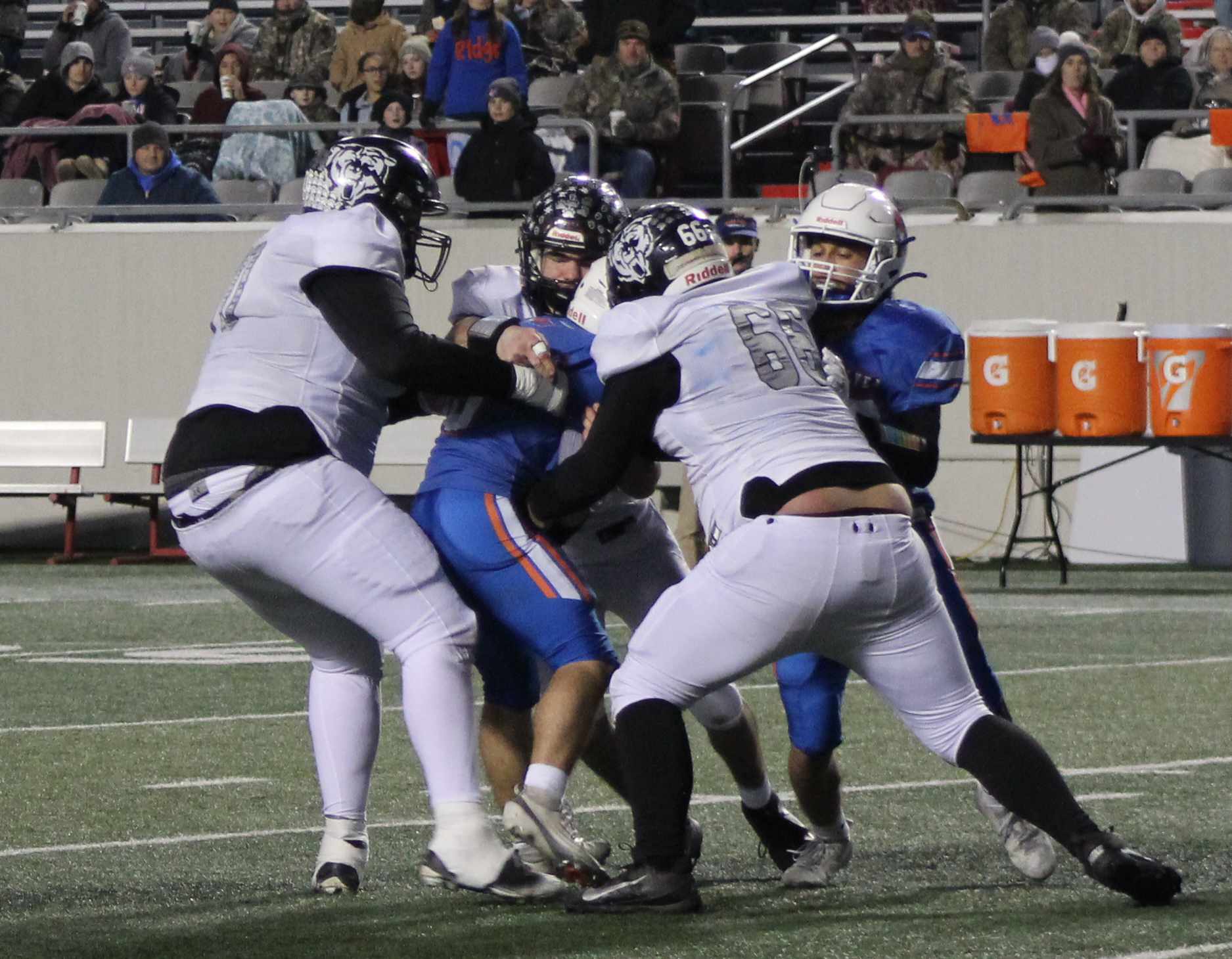 TACKLES FOR LOSSES - Despite giving up more than 500 yards of total offense, the Woodlawn defense did have it moments. Here, Woodlawn seniors Aiden Powell (left), Matthew Green (center) and Dakota Campbell trap a Cedar Ridge running back in the backfield for a loss. The Bears had 10 tackles behind the line of scrimmage for 55 yards in losses.