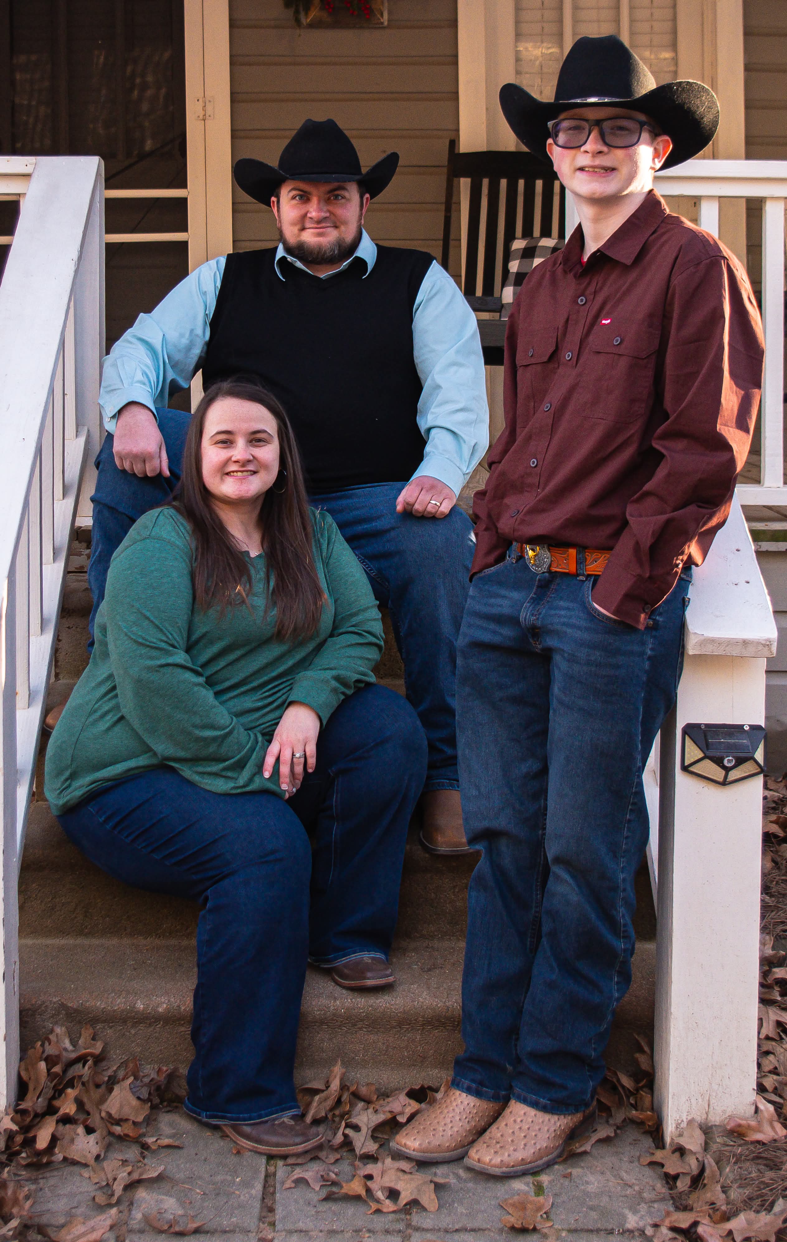 County Judge candidate Stephen McClellan (top of stairs) with his wife, Brooklyn (left) and son Gabriel (right)
