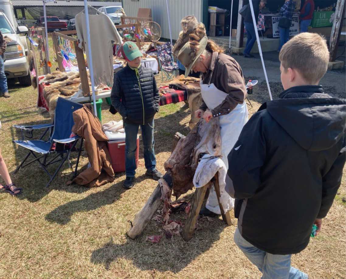 HIDE TANNING - Shona Jordan scraps a hide to prepare it for tanning during the 2024 Arkansas Homesteading Conference. The Pike County residents will be one of the presenters at the Pioneer Crafts Festival on April 11
