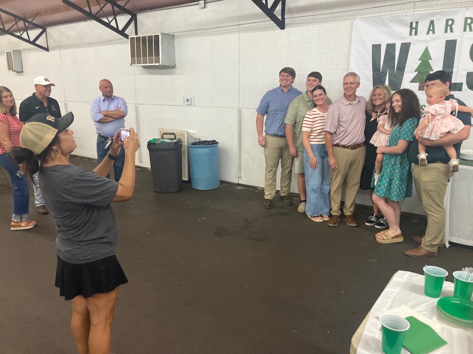WILSON CELEBRATES WIN - Angel Jacobs of Rison (left) snaps a photo of Harrell Wilson (fourth from the left against the wall) with his wife, children and grandchildren after he won Tuesday’s State Senate District 1 special primary election. He now faces Eudora Mayor Tomeka Butler, the uncontested Democratic nominee, in a special election on Nov. 3. 