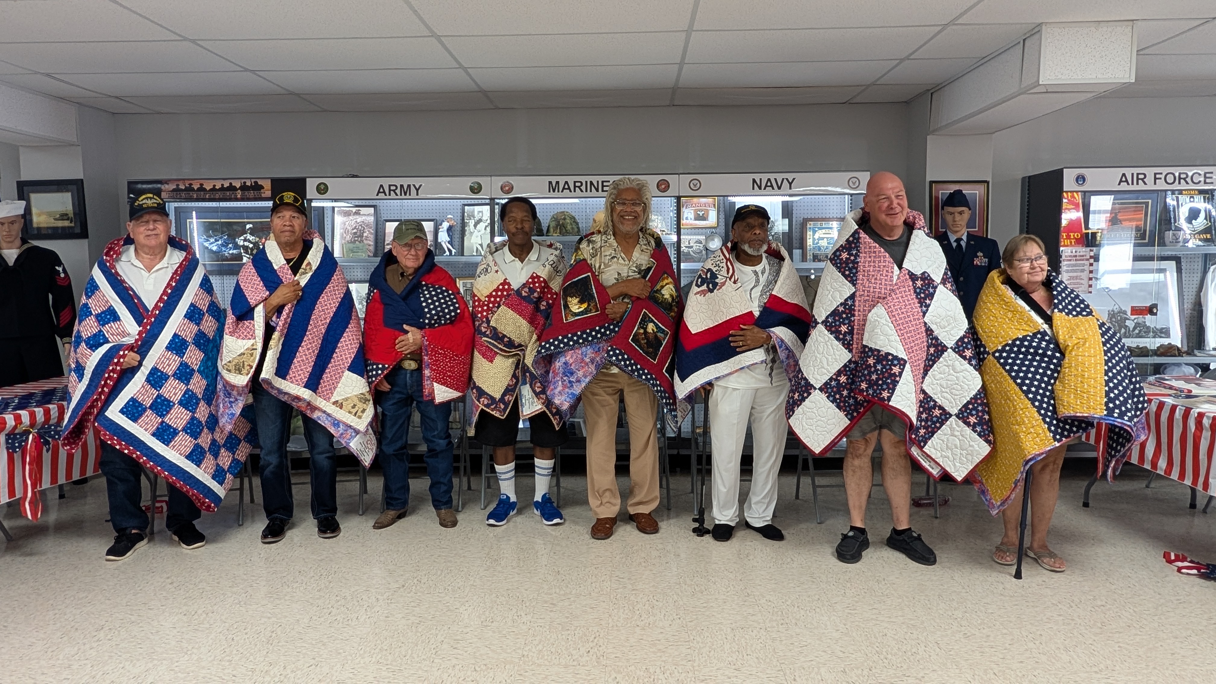 Pictured left to right are David Clark, U.S. Navy; Bobby Joe Johnson, U.S. Army; James Smith, U.S. Army; Leon Shannon, U.S. Navy; Jerry O’Neal, U.S. Army; Joseph O’Neal, U.S. Army; Greg Rowland, U.S. Navy; and Rikki Rowland, U.S. Navy.