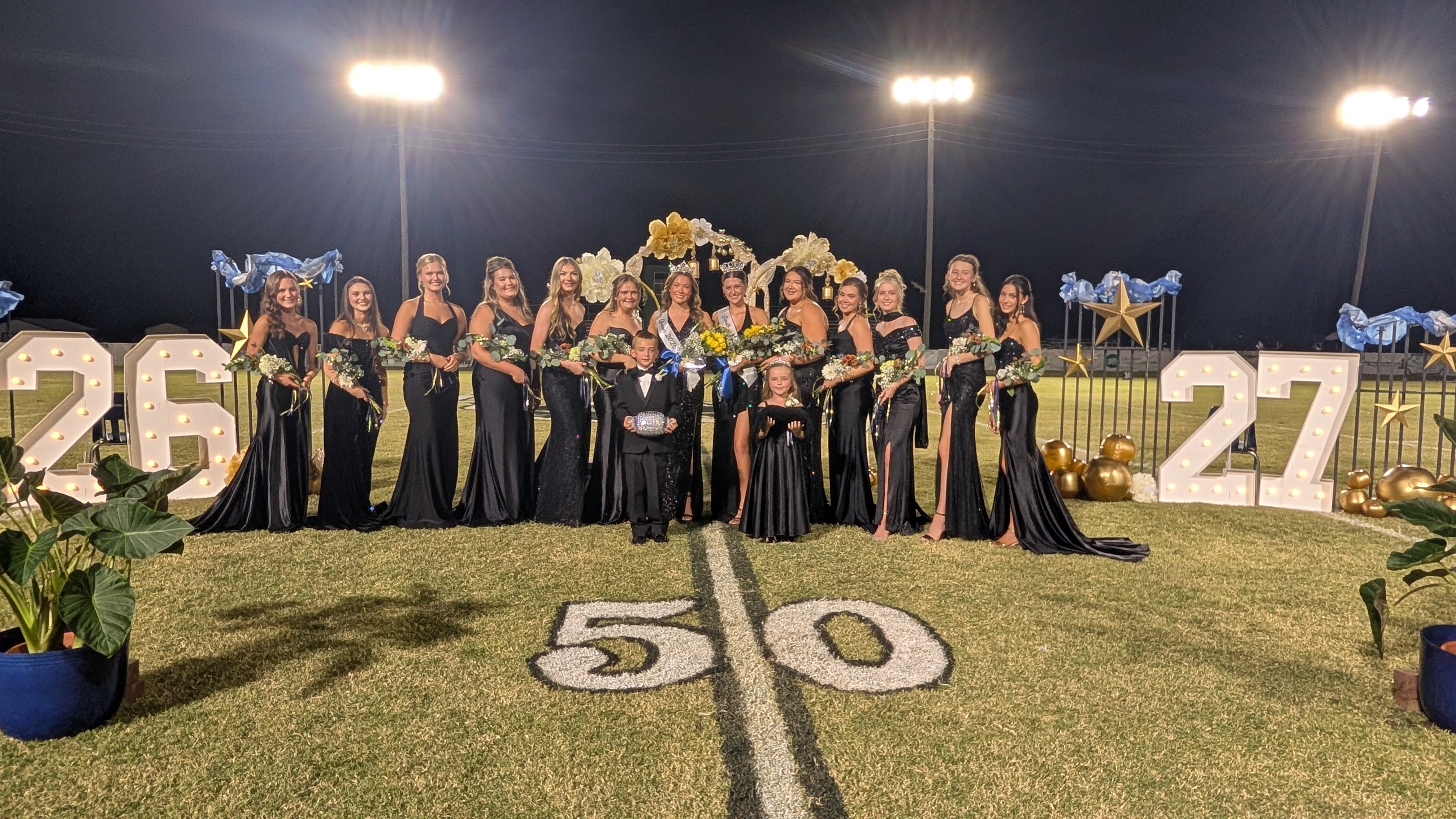 Pictured left to right are Alivia Nixon, Riley Swan, Brinley Allred, Zoey Hunter, Brynne Stover, Anna Brown, Leah Brewer, Sadie Hall, Ella Wooden, Anslee Aud, Erin Vinson, Emily Reed, Emerlynn Stratton. Mascots in front are Ridge Jones and Emerson Ashcraft.