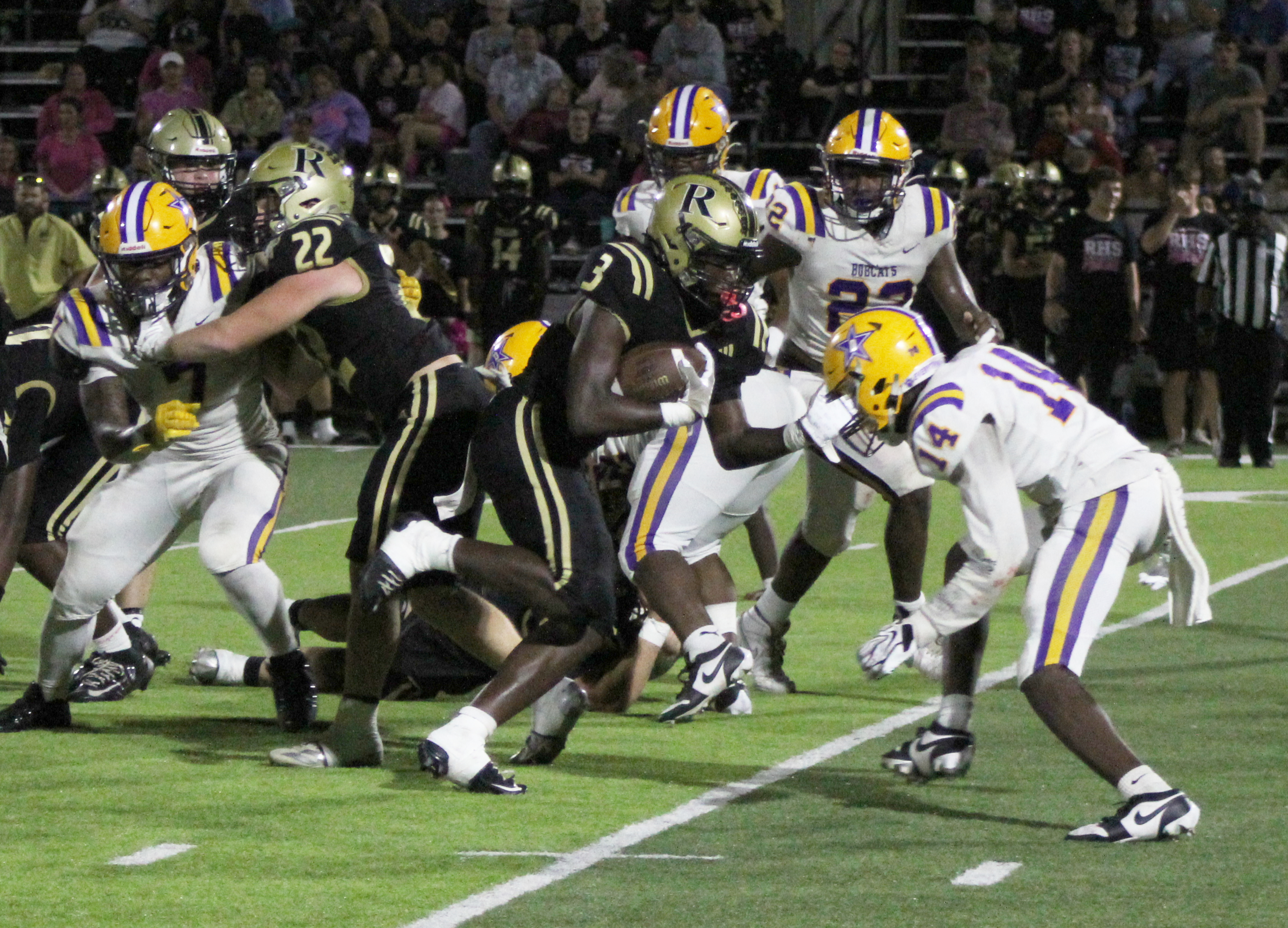 BIG NIGHT FOR WALKER - Rison senior Kyson Walker (3) follows the block of Aidan Bitely (22) as he takes on Dumas defender during first half action of the Wildcats’ wild 65-42 win over the Bobcats Friday night. Walker rushed for 209 yards on 22 carries with seven touchdowns.