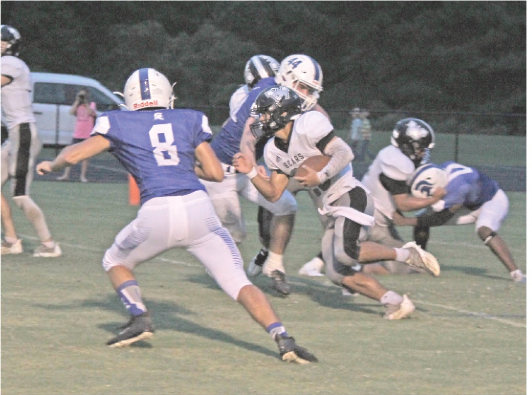 BIG NIGHT FOR CALEB MARTIN ■ Woodlawn senior running back Caleb Martin (center, with ball), seen here in the Bears' first game with Parkers Chapel on Sept. 2, scored four touchdowns in the re-match with the Trojans last Friday night at the Carl Jones Sports Complex. In addition to scoring on runs of one, 31 and 32 yards, Marlin also had a 75 kickoff return for a touchdown. He finished wit 74 yards rushing on just four carries to average 18.5 yards per attempt.