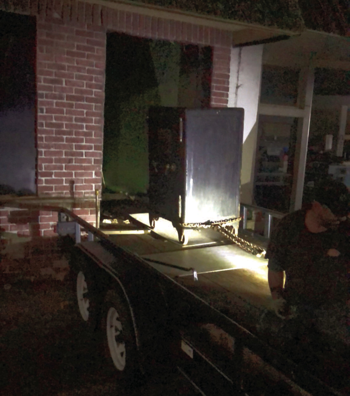 REMOVING SAFE - Johnny Howard and his crew remove the 4,500-lb. safe from the old Cash Grocery store on Main Street last Thursday evening.