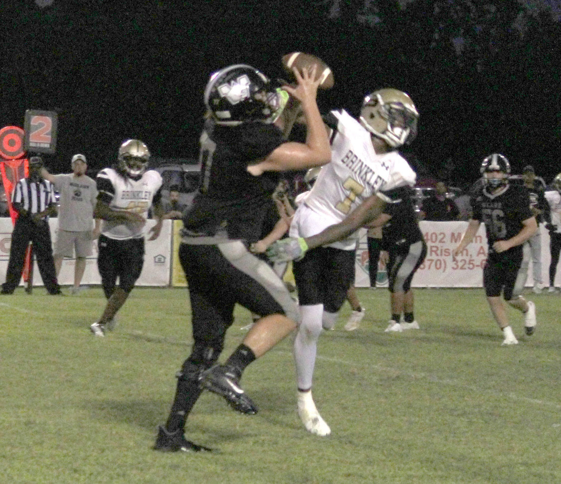 KITCHENS TAKES IT TO THE HOUSE - Woodlawn junior tight end Braiden Kitchens pulls in a pass over Brinkley’s Tylon Jones before turning upfield for a 17-yard touchdown reception in the second quarter. Kitchens’ score pulled the Bears even with the Tigers, 12-12.