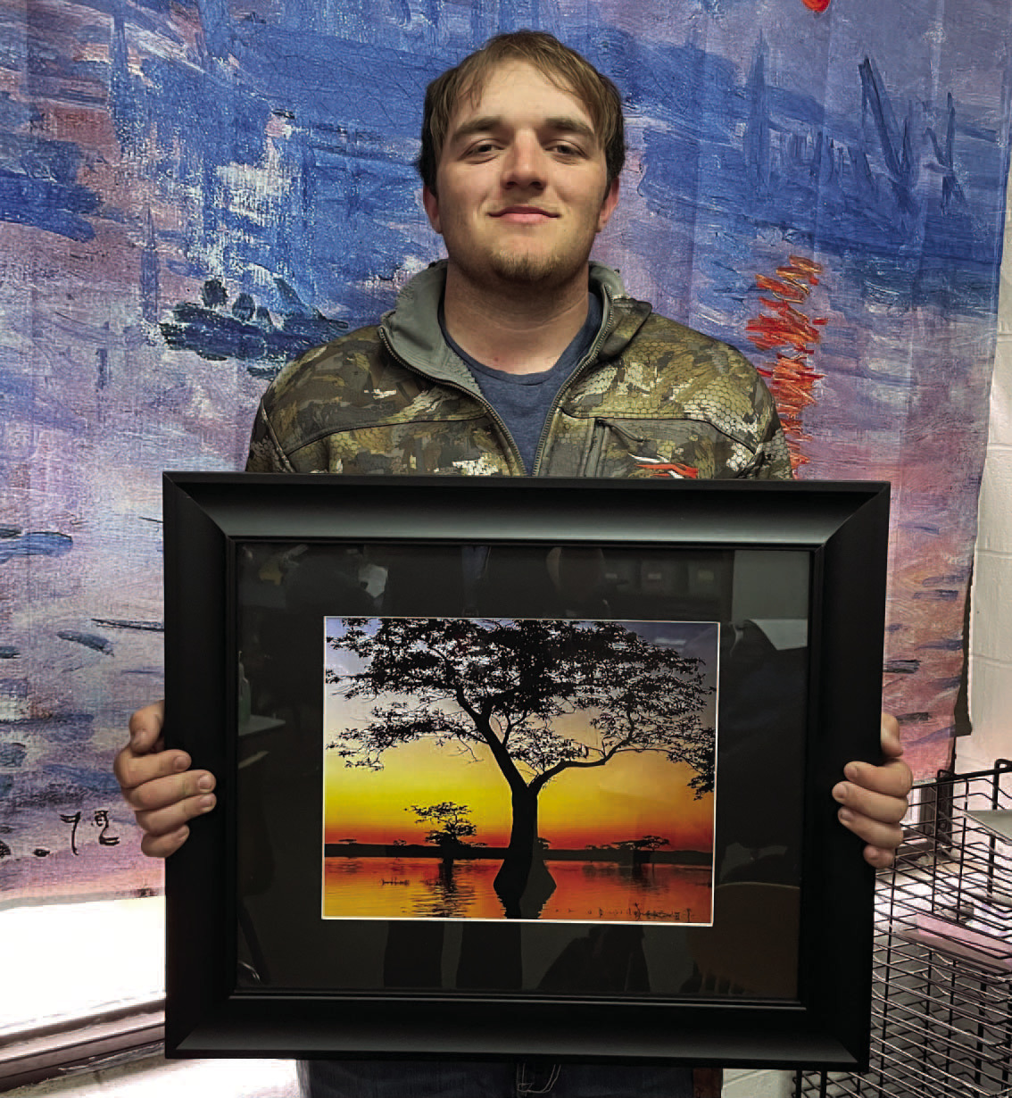 Braden Matthews and "Sunrise Before the Hunt" Photo credit: Lesley Hipp, Rison High School Art Teacher
