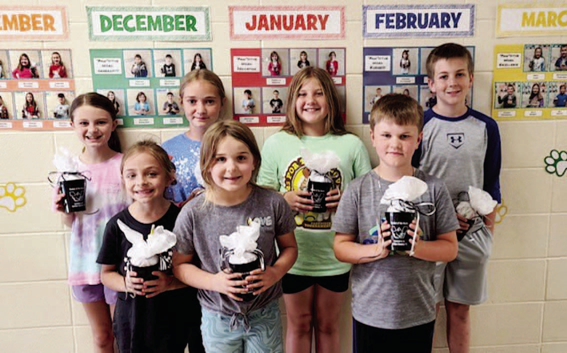 WOODLAWN ELEMENTARY STUDENTS OF THE MONTH - These students exhibited "Commitment," which was the May 'Paw'sitive word of the month. Pictured are, Back Row: Josie Young (4th grade), Maci Holland (5th grade), Emalyn Clement (3rd grade), Brit Swan (6th grade); Front Row: Macie Marcantel (1st grade), Millie Sowrheaver (kindergarten), Jace Gavin (2nd grade).