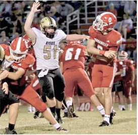 DEFENSE STEPS UP IN SECOND HALF - Rison's Ryan Cottrell (no. 51) brings the heat on Dardanelle quarterback Creed Vega during last week's non-conference game at Dardanelle. (Photo by Kim Kaye King)