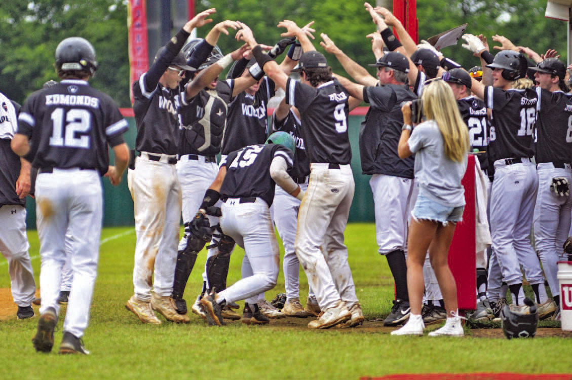 The Woodlawn Bears congratulate Brayden Jones (no. 15) after smashing a three-run homerun in Friday's semifinal against Murfreesboro as the Bears routed the Rattlers, 19-4. Jones also had a double in the game and finished with four RBIs in the 19-4 rout. Woodlawn are seeking a third consecutive state title.