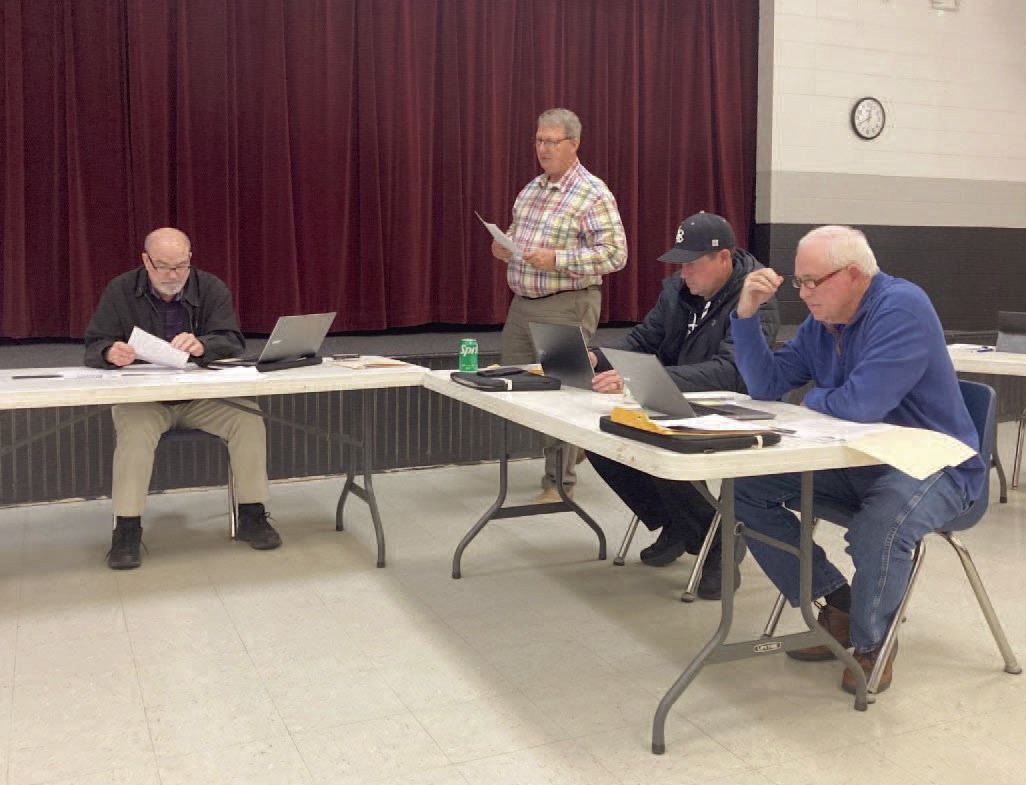 WOODLAWN SCHOOL BOARD MEETING - Woodlawn Superintendent Dr. Kevin Hancock (center) addresses the Woodlawn School Board during its regular monthly meeting Monday night. Hancock went over the impact the new Arkansas LEARNS Act will have on the school district. Also pictured are (left to right) Board President Larry Reynolds, Board Secretary Shane Dixon and board member David Stover.