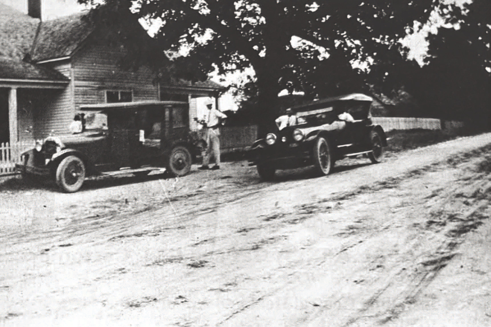 GLIMPSES FROM THE PAST - The people seen in this glimpse fro m the past are not identified, but this is the old Mosley home and a couple of cars in front of the residence on East Magnolia Street (Hwy. 133) in Rison in 1927. For questions or comments, contact Stan Sadler at sadler.stan@yahoo.com