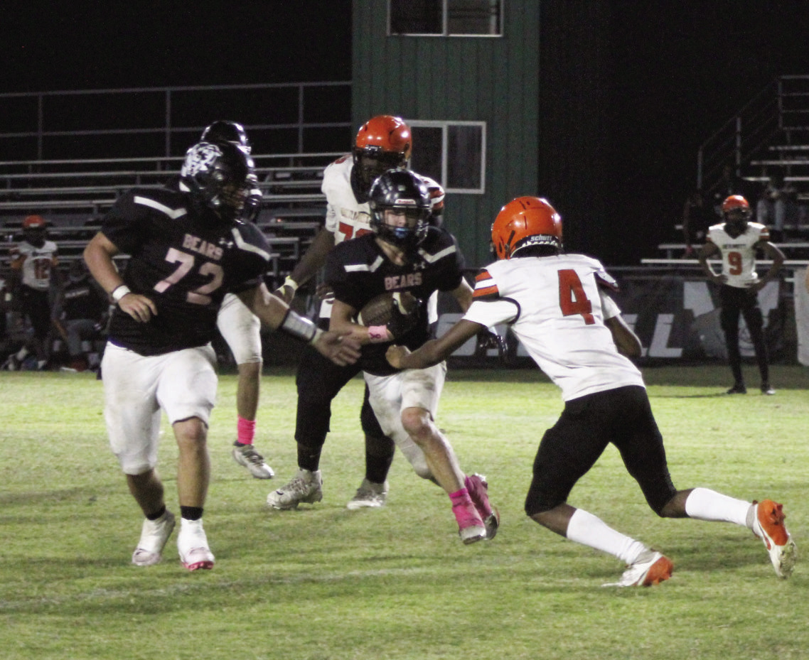 BIG NIGHT FOR THE RUN GAME - Woodlawn fullback Ace Culliford (72) moves out to set a block for running back Griffin Manes (1) during the Bears 76-56 win over Dermott Friday night at the Carl Jones Sports Complex. Manes rushed for 219 yards and scored four touchdowns while Culliford had 39 yards and two touchdowns. Woodlawn rushed for 466 yards on the night.