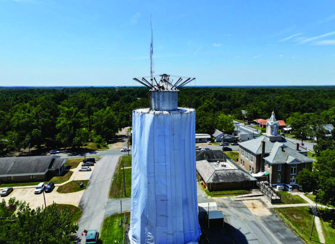 RISON WATER TANK IMPROVEMENTS - A giant curtain covers the "Tin Man" water tank located next to the courthouse in Rison as work begins on more than $7 million in grants to improve the city's water and wastewater infrastructure. (Photo by Rison High School EAST Lab)