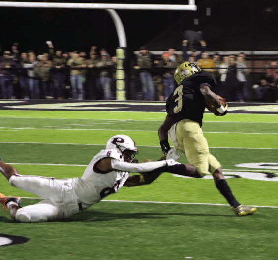 FOURTH DOWN BREAKAWAY - Facing fourth-and-5, Rison's ZaKyler Walker (no. 3) slips away from the tackle of Prescott's Ra'Shawn Bell to go 31 yards to the Curley Wolves' 1 late in the fourth quarter to set up the Wildcats' game winning touchdown. (Photo by Chris Phillips)