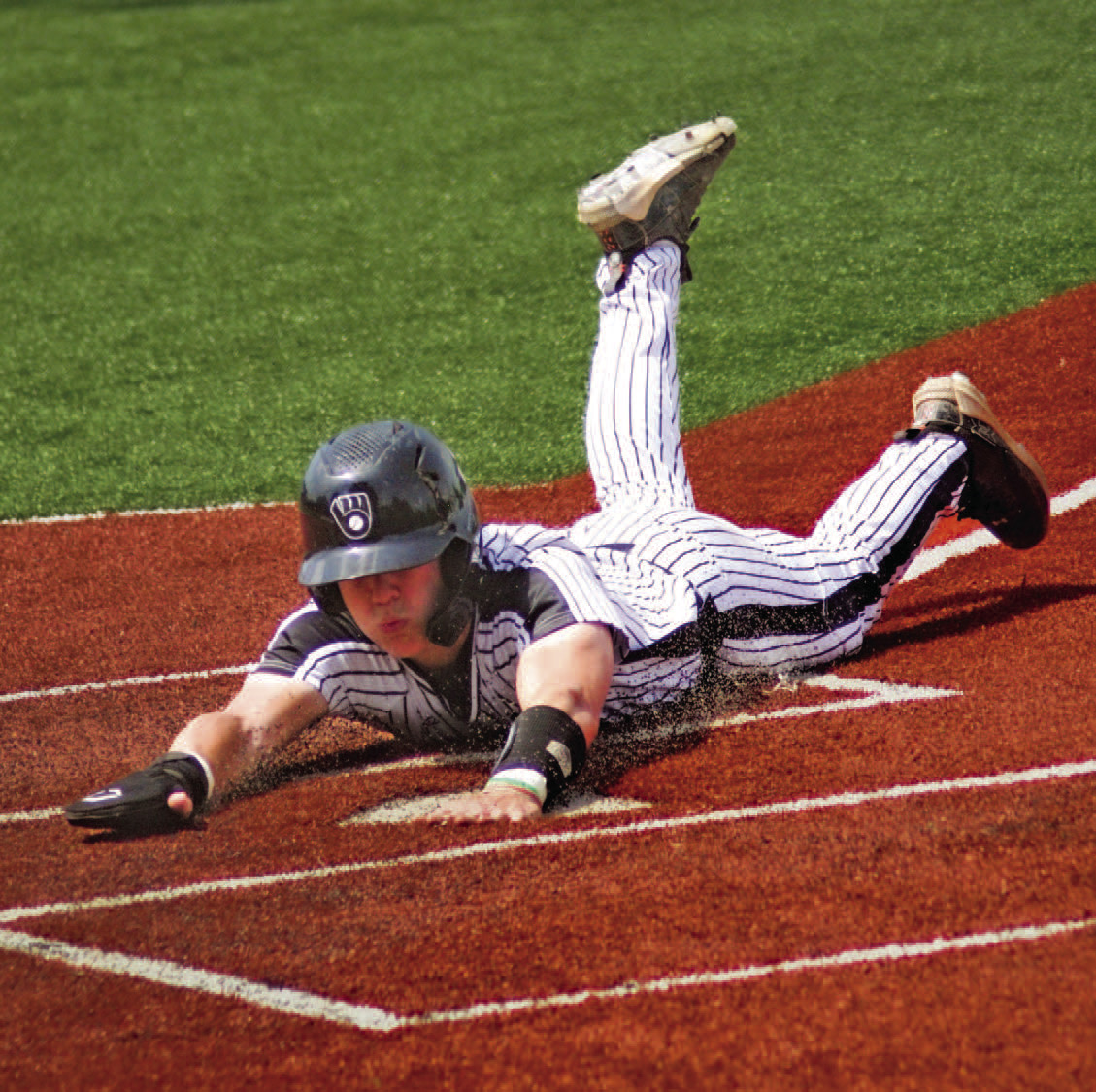 BIG TOURNAMENT FOR BRAYDEN JONES - Woodlawn junior shortstop Brayden Jones slides into home for one of two runs he scored Saturday afternoon in the Bears' 10-0 win over Center Ridge in the Class 2A semifinal game at Greenland High School. Jones was a spark plug for Woodlawn throughout the Class 2A State Tournament, going 5-for-9 at the plate over the three games with seven RBIs. His grand slam homerun in the second inning against Mansfield turned the game into a rout. (Photo by Kelvin Scott)