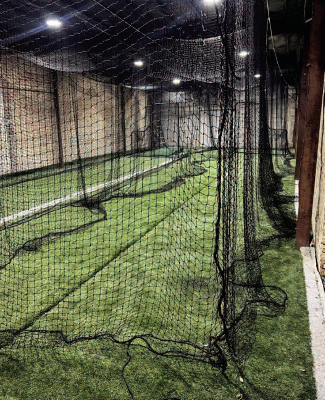 THE DEN - This shots shows the first two batting cages installed in the first building. Austin Saeler said he would like to have two more cages installed in the other building by Halloween. (Photo courtesy of The Den)