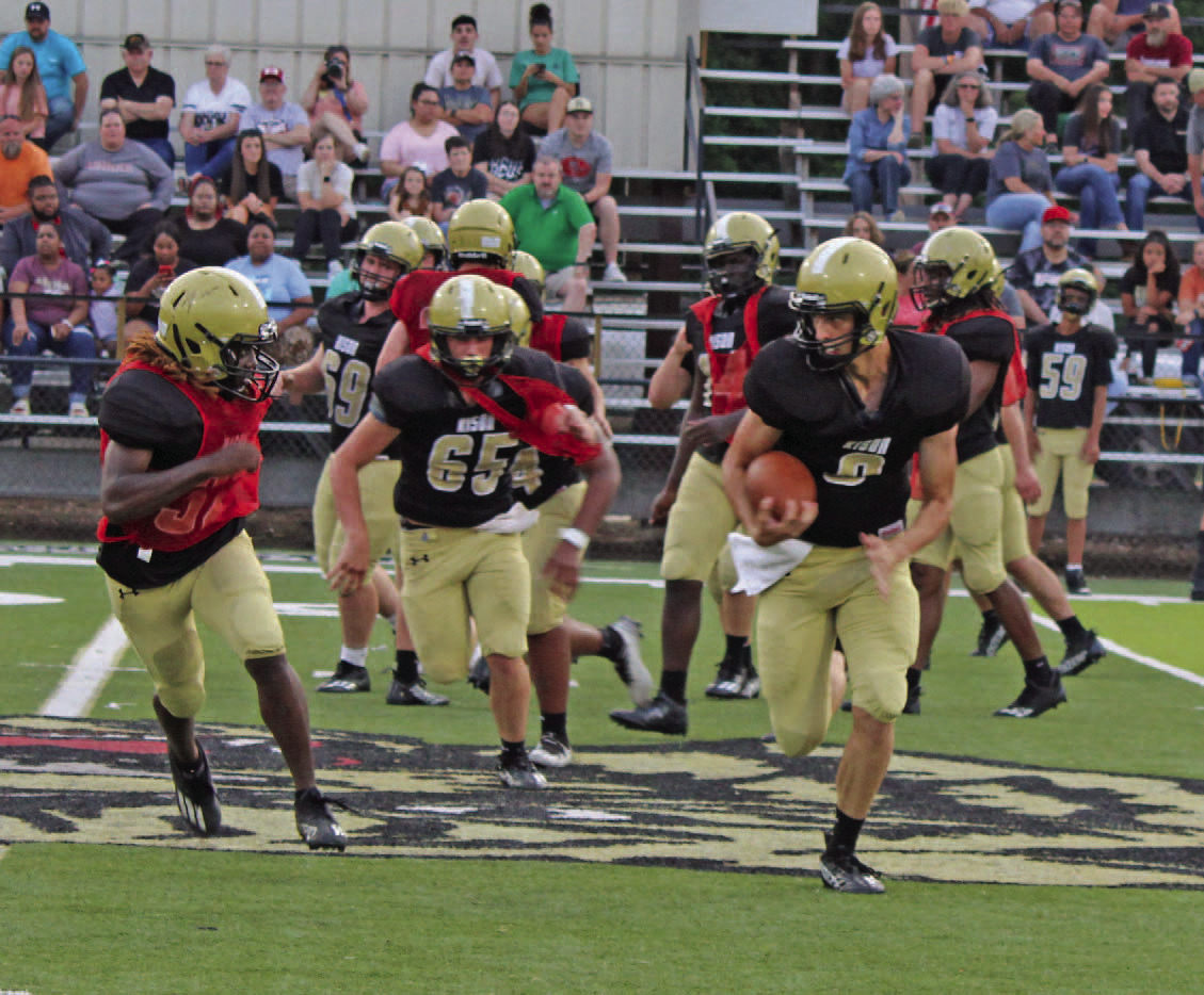 MORRISON EXECUTES RPO - Rison senior-to-be quarterback Owen Morrison breaks outside for a decent gain during the Black and Gold scrimmage last week. Morrison seemed to have picked up the run-pass option rather well as he was picking up some nice gains on the keepers.