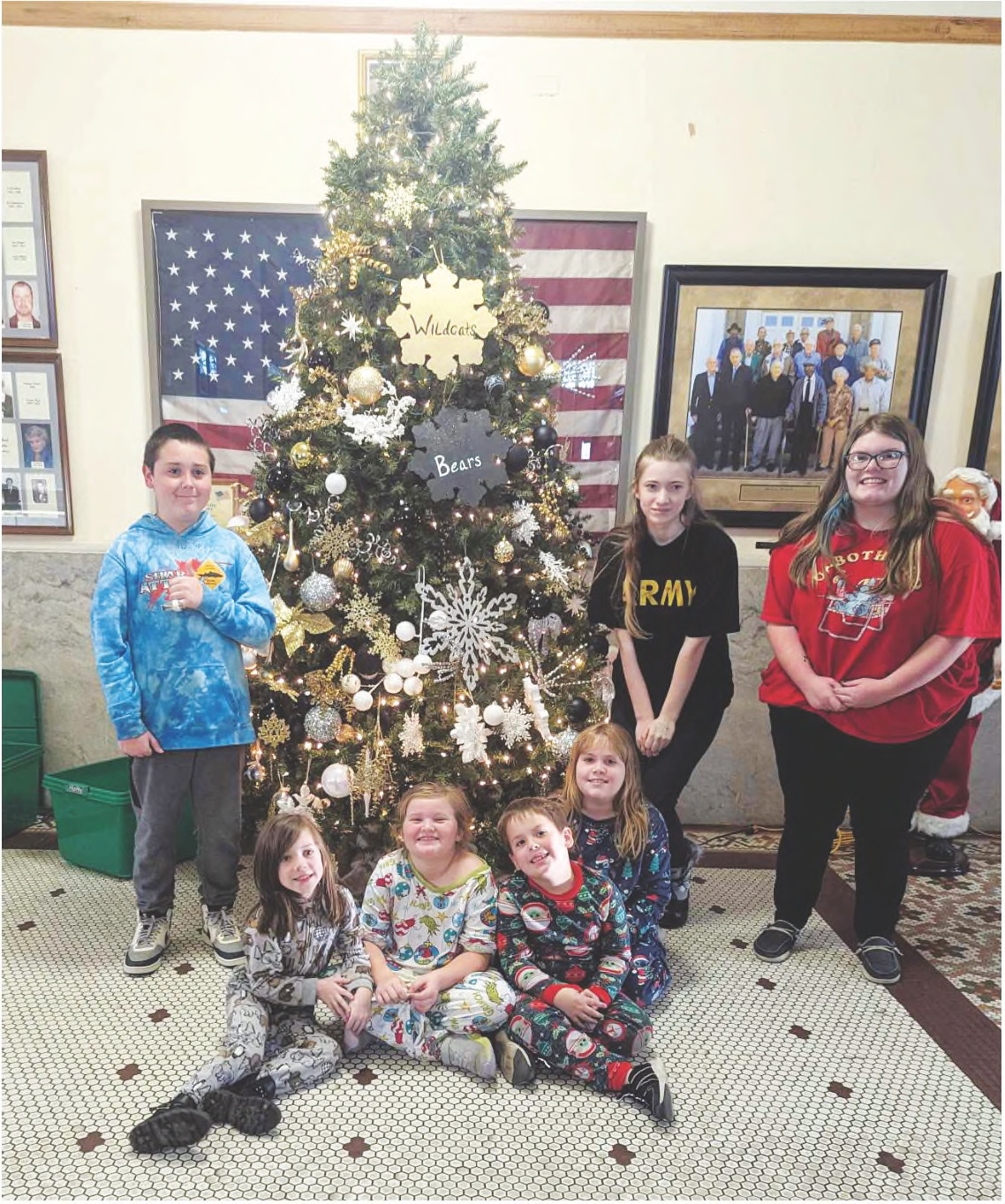 DECKING THE HALLS AT THE COURTHOUSE - The Christmas tree inside the Cleveland County Courthouse was decorated this year by the children of the office staffs. Pictured are Andrea McDaniel, Beau Herring, Mitchell Herring, Aria Brown, Lana Brown, Edie Ingram, Jeremiah Mull and Aubrie Mull.