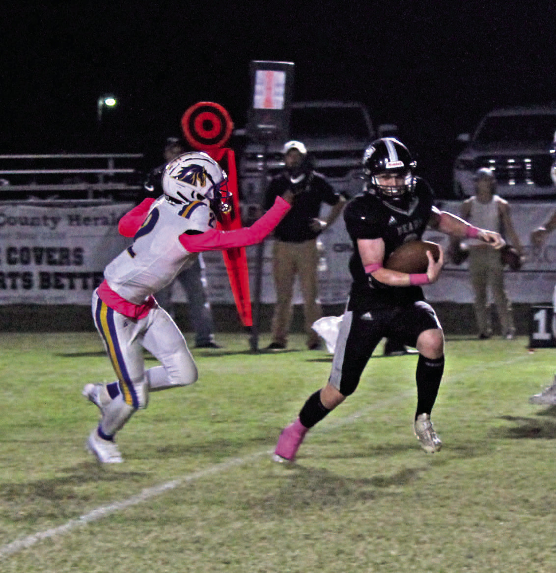 BREAKOUT GAME FOR WEATHERFORD - Woodlawn's Garrett Weatherford (right) eludes the tackle of Marvell-Elaine's Tryeiven Campbell on his way for another gain last Friday night. Weatherford had 179 yards of total offense after rushing 12 times for 133 yards and two touchdowns while hauling in a 46-yard touchdown pass from Aden Moore.