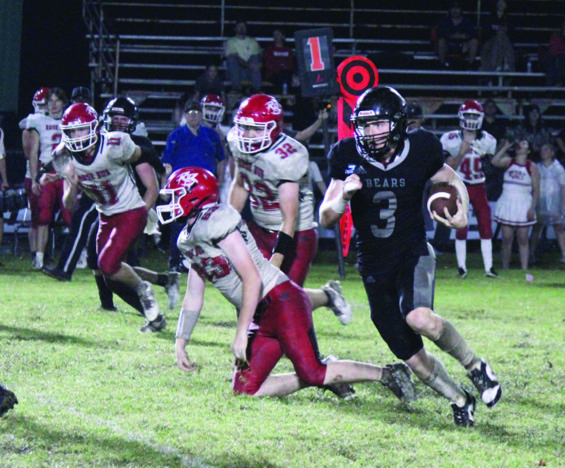 MAN ON A MISSION - Woodlawn senior running back Garrett Weather ford (no. 3) breaks free for another nice gain during second half action of the Bears' 50-18 win over Rose Bud. Weatherford averaged 14 yards per carried as he finished with 228 yards rushing and scored seven touchdowns. He scored on touchdown runs of 28, 37 and 35 yards in the third quarter.