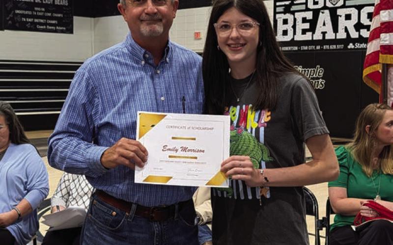 Stephen Boyd presents the Cleveland County Farm Bureau Scholarship to Kate Morrison