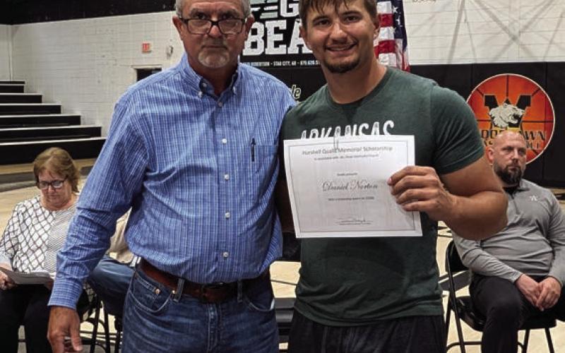 Stephen Boyd presents the Hurshell Qualls Memorial Scholarship to Daniel Norton