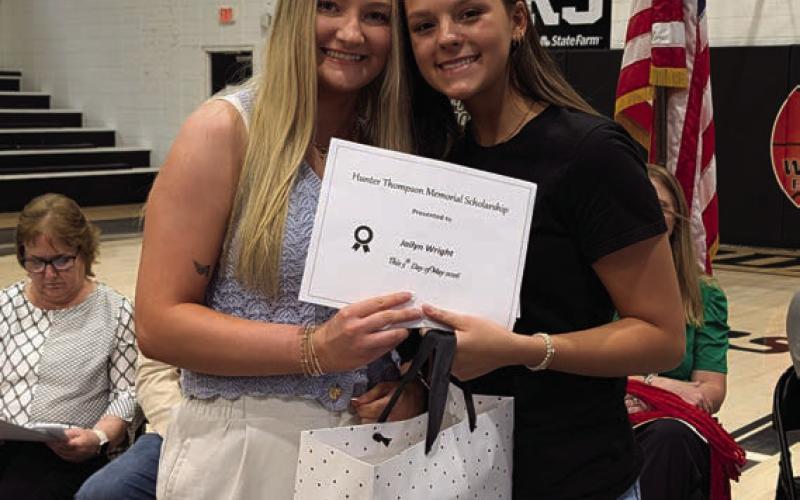 Lauren Thompson presents the Hunter Thompson Memorial Scholarship to Jailyn Wright