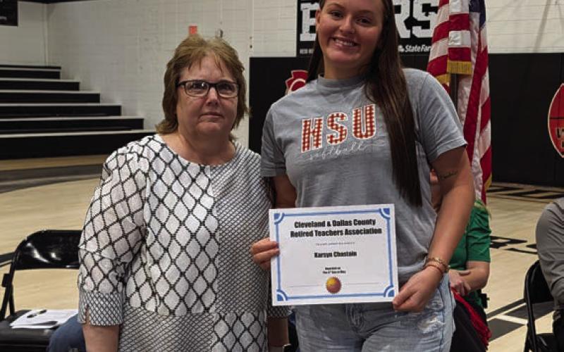 Karen Talent presents the Retired Teachers Association Scholarship to Karsyn Chastain