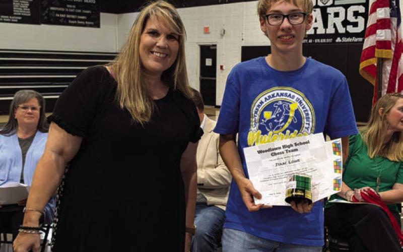 Misty Davis presents the WHS Quiz Bowl and Chess Scholarship to Isaac Lowe